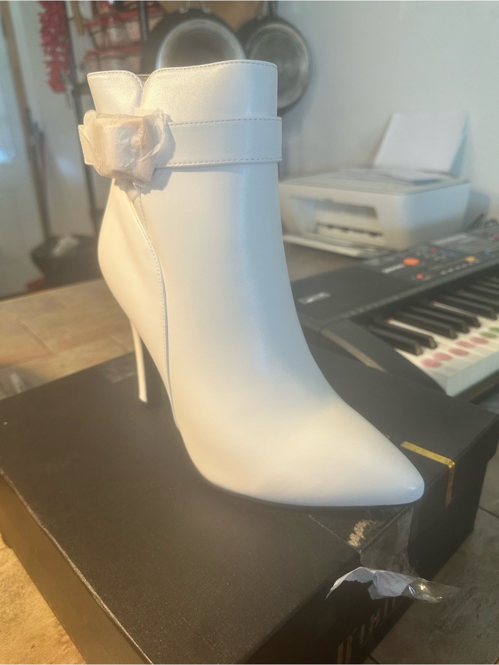 Elegant White Pointed-Toe Stiletto Ankle Boot with Floral Accent